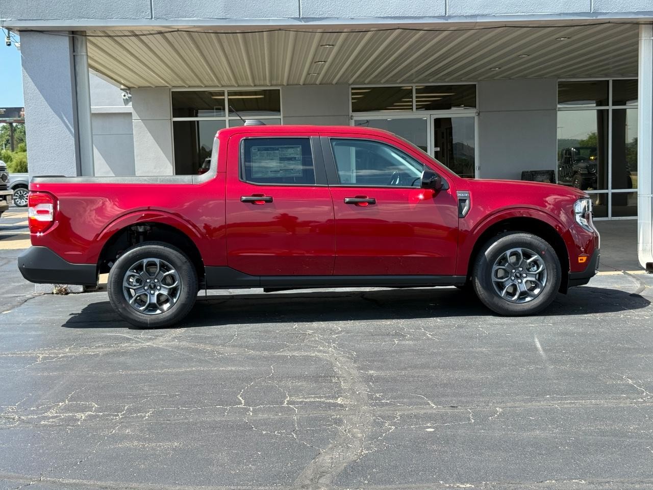 2025 Ruby Red Metallic Tinted Clearcoat Ford Maverick XLT AWD Truck